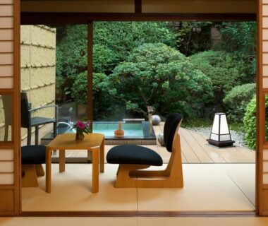 Tatami seating area opening to landscaped garden at Ito Ryokuyu in Chūbu Shizuoka Japan
