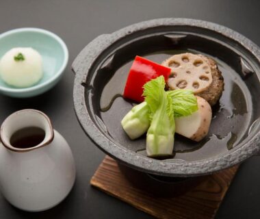 Simmering pot with lotus root, red pepper, greens and dipping sauce at Ito Ryokuyu in Shizuoka