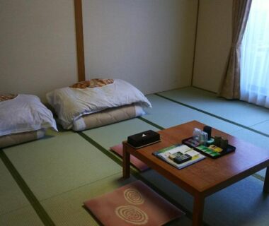 Traditional tatami room with futons, low table and tea set at Itoen Hotel Hakone Yumoto in Kanagawa