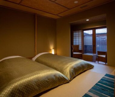 Tatami flooring with two low beds, shoji screens and balcony seating at Itsukushimahigashimonzen Kikugawa Hiroshima