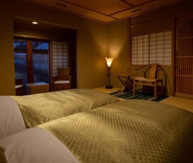 Tatami room with twin low beds and shoji doors at Itsukushimahigashimonzen Kikugawa, Hiroshima, Chūgoku