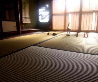 Traditional tatami flooring and shoji screens with soft sunlight inside Itsumoya in Hiroshima