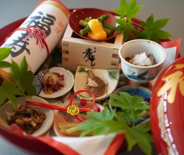 Lacquer tray with assorted small dishes and maple leaf garnish at Iwaiyado Jyuan Nikko Kawaji Tochigi