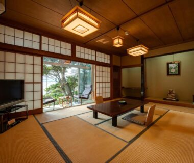 Tatami-floored room with low table and shoji doors at Iwamotoro in Kanagawa Japan