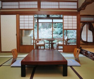 Traditional tatami room with low table and shoji screens at Iwaso in Hiroshima
