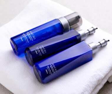 Blue toiletry bottles on white towel at Iyashi no Yado Iroha in Oita, Kyushu, Japan