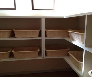 Shelving with woven baskets for guest storage at Iyashinoyado Rodem in Iwate Tohoku