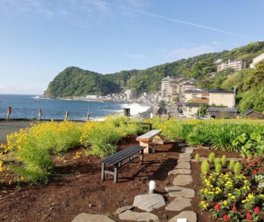 Garden path with benches by the coast at Izu Hokkawa Seaside Guesthouse Shizuoka Chubu