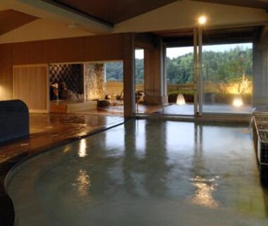 Spacious indoor onsen bath with large windows at Izu-Nagaoka Hotel Tenbo, Shizuoka