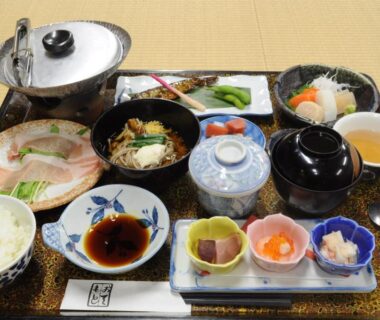 Tray of assorted Japanese dishes with rice, soup, pickles and small seafood at Izumi-so, Gifu