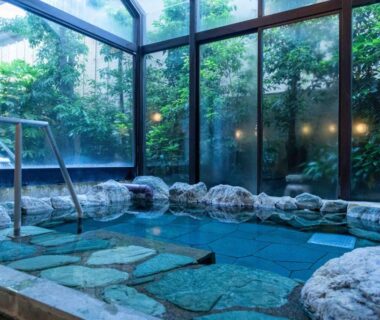Indoor stone onsen bath with garden view at Izumiso, Nagano, Chūbu Japan