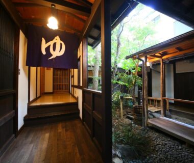 Traditional wooden corridor with bath noren at Izumiya Zenbe in Nagano, Chūbu