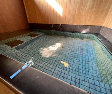 Small indoor tiled onsen bath with wooden walls at Morigen Japanese style hotel and dining in Kyoto Kansai