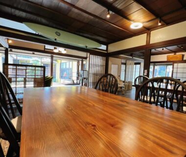 Long wooden dining table with chairs and shoji screens at Morigen in Kyoto