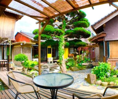 Covered patio table in a traditional courtyard garden at Morigen ryokan, Kyoto, Kansai