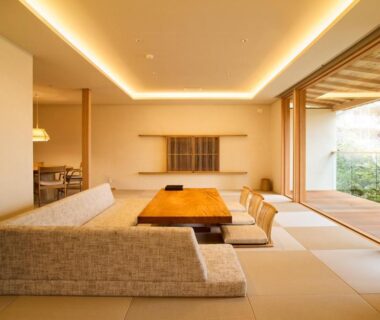 Tatami living area with low table and sliding doors at Jinya Ryokan in Kanagawa, Japan