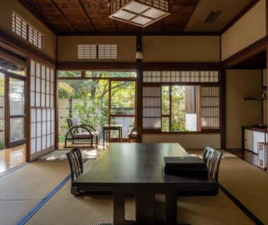 Traditional tatami room with low table and shoji screens at Jinya Ryokan in Kanagawa, Kantō