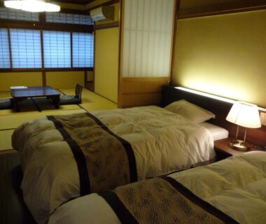 Twin beds on tatami with shoji screens and low table, Jizokan Matsuya Ryokan, Nagano, Chūbu Japan