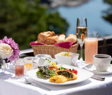 Balcony breakfast with omelette, bread and drinks at Jodogahama Park Hotel in Iwate, Tōhoku