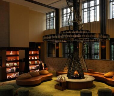 Central fireplace lounge with circular seating at Jozankei Tsuruga Resort Spa Mori no Uta, Hokkaidō