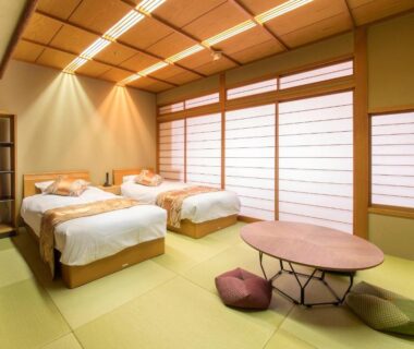 Tatami floor room with twin beds, shoji screens and low table at Juhachiro, Gifu, Chubu Japan