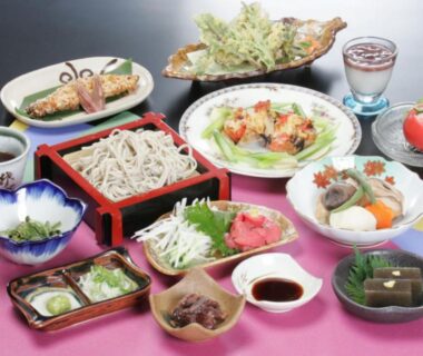 Assorted small dishes and cold soba with dipping sauce at Juvankan ryokan in Nagano Chūbu