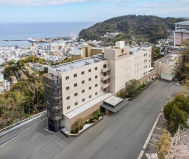 Hotel facade on coastal hillside, KAMENOI HOTEL Atami Annex, Shizuoka prefecture