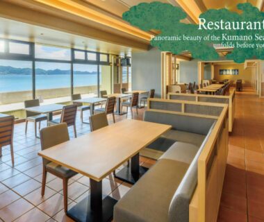 Restaurant dining area with large windows overlooking the sea at KAMENOI HOTEL Nachi Katsuura, Wakayama