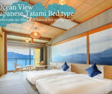 Tatami room with twin beds, shoji screens and balcony sea view at KAMENOI HOTEL Nachi Katsuura, Wakayama