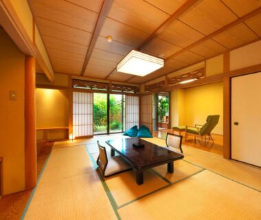 Traditional tatami room with low table and shoji doors at Kagetsutei in Shizuoka, Chūbu Japan