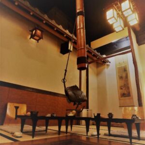 Irori hearth with suspended kettle and low tables in Kaigetsu ryokan, Mie, Kansai