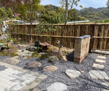Stepping stone path, bamboo fence and stone water basin in a small garden at Kairi, Hyōgo