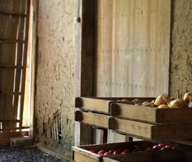 Wooden crates of produce beside earthen plaster wall in Kairi ryokan, Hyōgo, Kansai