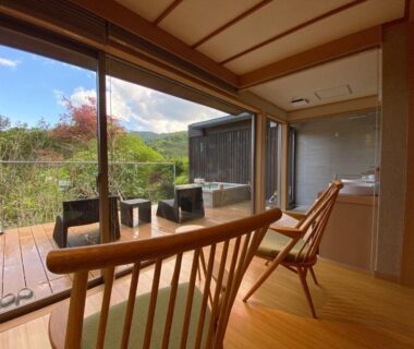 Tatami room with wooden chairs, deck and indoor wooden tub at Kaiseki Ryokan Ashikari in Kanagawa