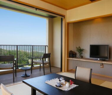 Tatami room with low table and balcony chairs at Kakimotoya overlooking Nara countryside
