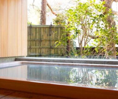 Wooden bath opening to bamboo fence and garden at Kamakura COCON, Kanagawa, Kantō