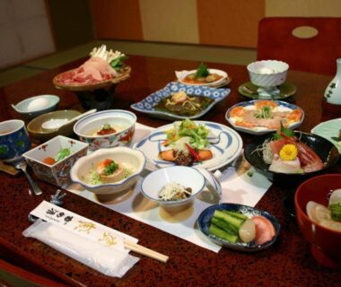 Assorted small Japanese dishes on a low lacquered table Kamesei Ryokan Nagano