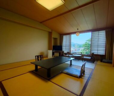 Tatami room with low table and shoji screens at Kameya Ean in Shizuoka, Chūbu, Japan