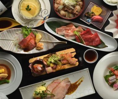 Assorted small plates and bowls of traditional Japanese multi-course meal served at Kami no yama Azumaya in Yamagata
