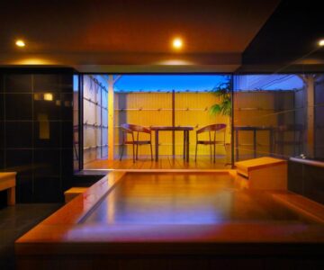 Wooden indoor bath with terrace seating at Kami no yama Azumaya in Yamagata, Tōhoku