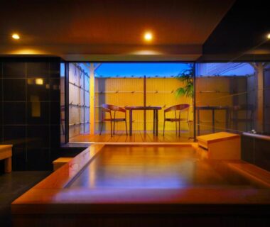 Wooden indoor bath with terrace seating at Kami no yama Azumaya in Yamagata, Tōhoku