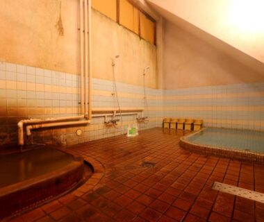Tiled communal indoor baths with multiple basins at Kamiobo ryokan in Hyōgo, Kansai