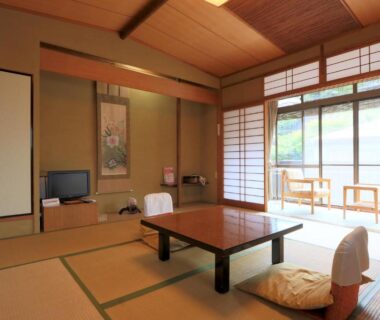 Tatami room with low table, zabuton cushions, shoji doors and veranda seating at Kamiobo, Hyōgo, Kansai