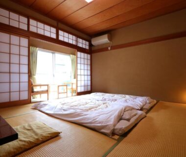 Traditional tatami room with futon bedding at Kamiobo in Hyōgo, Kansai, Japan
