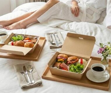 Breakfast trays with coffee and pastries on white bed at Kamishichiken Oku in Kyoto