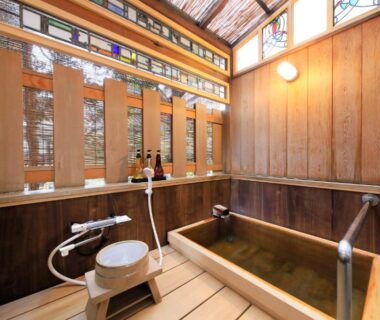 Wooden soaking tub with shower stool at Kamiyamada Hotel, Nagano, Chūbu Japan