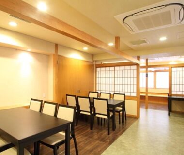 Dining area with tables and shoji screens at Kamogawakan in Kyoto, Kansai, Japan