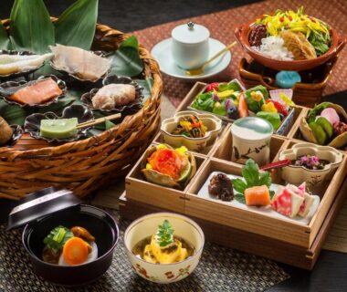 Compartmented wooden box and baskets with traditional Japanese small dishes at Kanazawa Hyakurakusou in Ishikawa, Chūbu