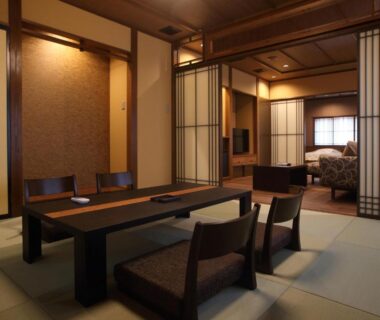Tatami seating area with low table and shoji screens at Kanazawa Yuwaku Onsen Kokarian, Ishikawa