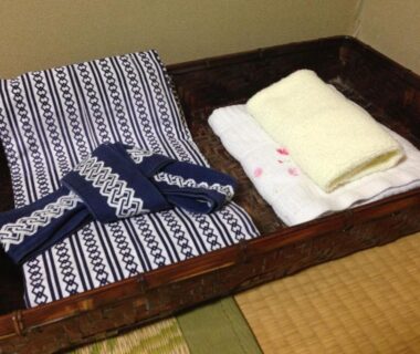Yukata and towels arranged on tatami tray at Kannawaso Ryokan in Oita, Kyushu, Japan